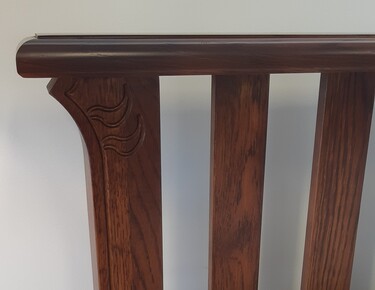 Clearance Oak bed showing detail of hand carving
